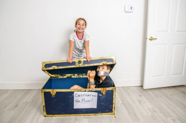 istock Girl expediting brother on the Moon 1253350322