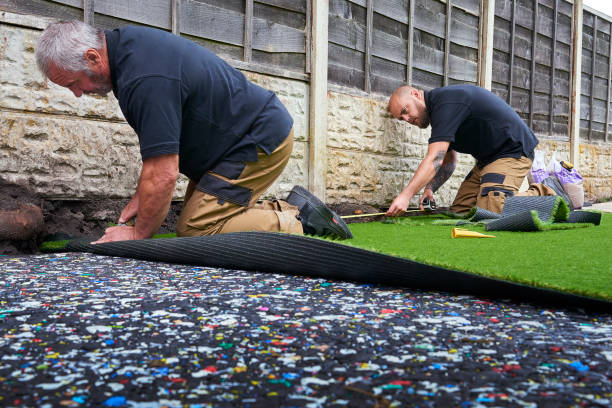 istock Trimming the edges of artificial grass 1253350357