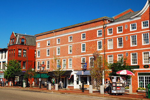 Portsmouth, NH, USA July 17 Historic Brick buildings house boutique shops and line the main street of Portsmouth New Hampshire