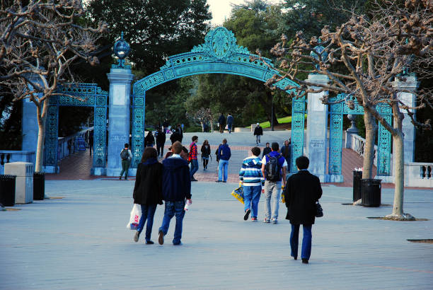 Sather Gate at Sproul Plaza at the University of California Berkeley Berkeley, CA, USA February 21, 2011 Students walk towards Sather Gate, the entrance to the University of California at Berkeley berkeley california stock pictures, royalty-free photos & images