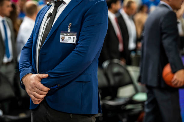 istock Security person standing on basketball court 1253352045