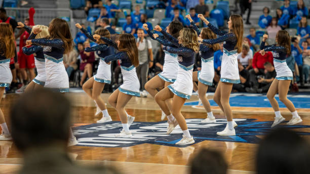 istock Cheerleaders performing on court 1253352078