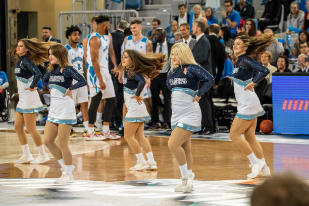 istock Cheerleaders performing on basketball court 1253352101