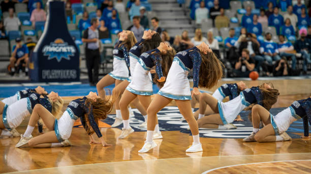 Cheerleaders performing on court