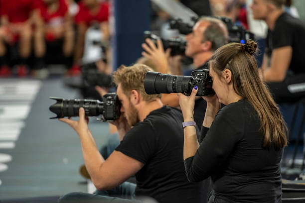 istock Camera person taking picture during basketball match 1253352250