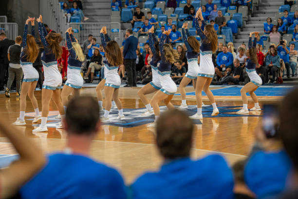 istock Cheerleaders performing on court 1253353597