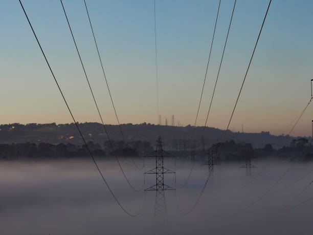 istock Electricity transmission lines at sunrise 1253363487