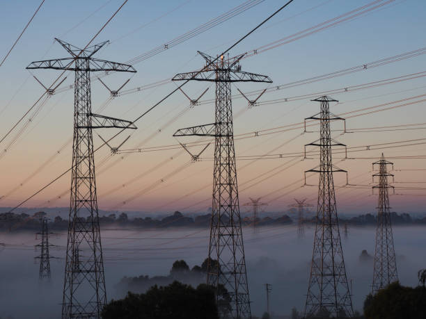istock Electricity transmission lines at sunrise 1253363504