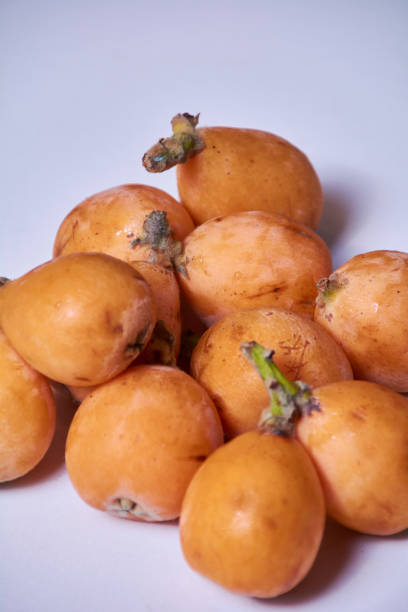 istock Set of medlars in order on white table 1253363566