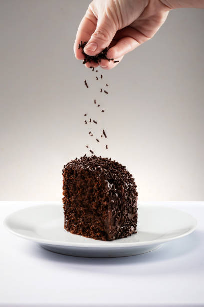 Slice of chocolate cake with granules