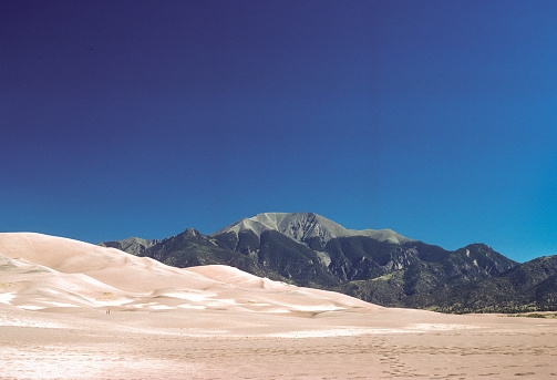 Great Sand Dunes NM - Dunes, Mountain & Colorado Sky - 1977. Scanned from Kodachrome slide.