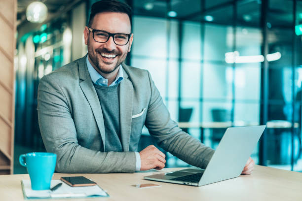istock Young businessman working at office 1253370536