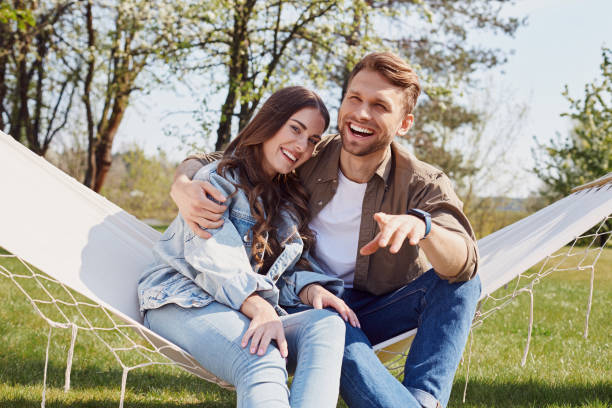 istock Happy man is hugging his girlfriend outdoors 1253374991