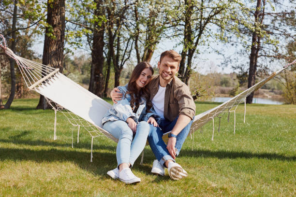 istock Happy young couple relaxing in the forest 1253374993