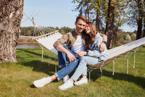istock Smiling loving couple spending day in forest 1253374996