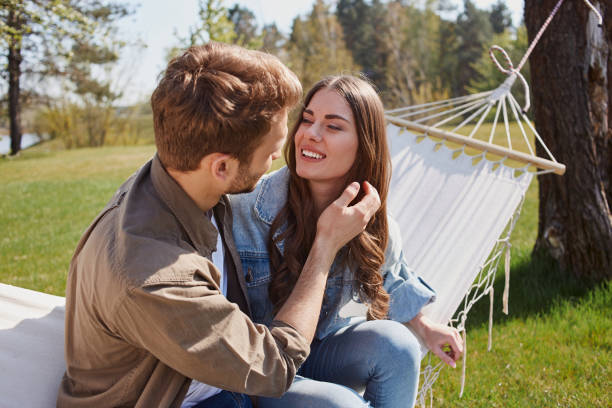 istock Young man talking to his girlfriend outdoors 1253375007