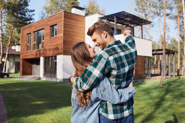 istock Happy man looking at his girlfriend against new home 1253375792