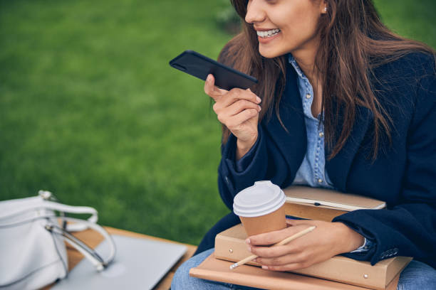 istock Attractive female student enjoying communication on mobile 1253379356
