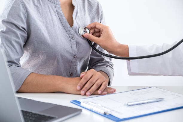 istock Doctor using a stethoscope checking patient with examining, presenting results symptom and recommend treatment method, Healthcare and medical concept 1253381368