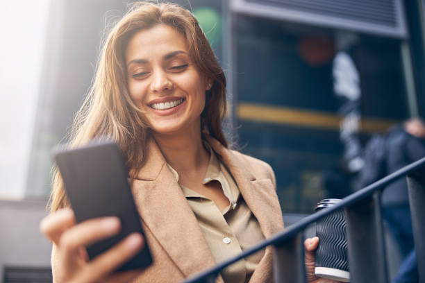 istock High-spirited blonde woman reading a text message 1253381510