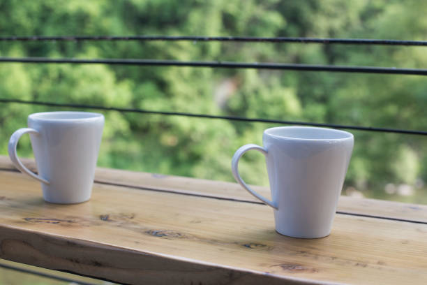 istock Coffee cup on wooden table in coffee shop. 1253382419