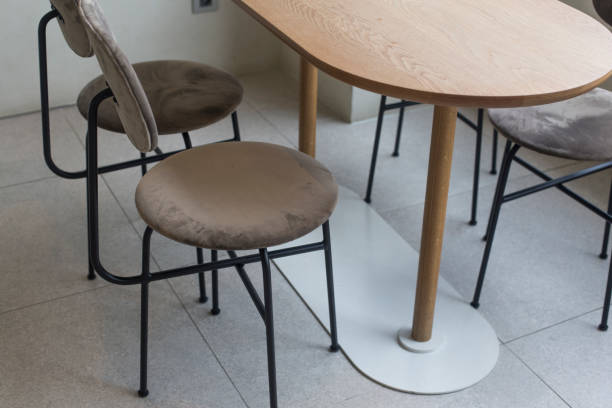 istock chairs and table in bright modern interior with white wall. 1253382479