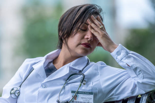 istock Hispanic female doctor taking a break outside 1253383262