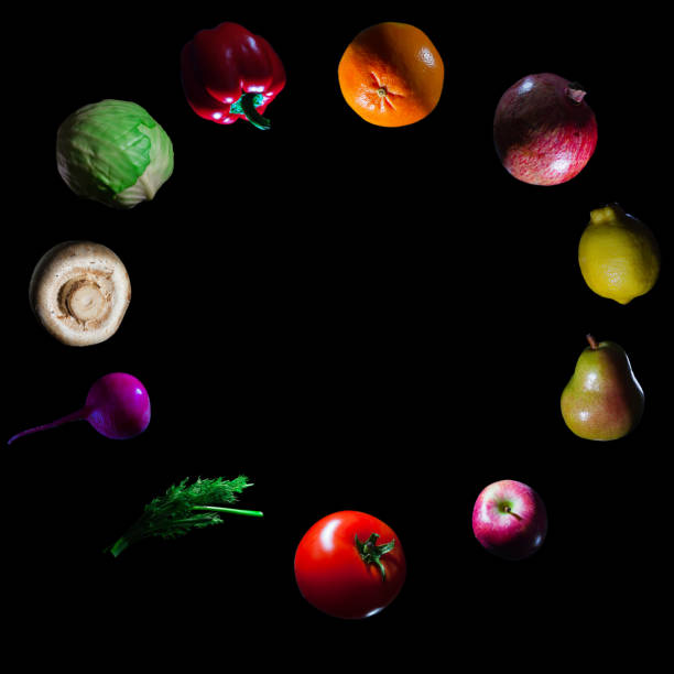 istock fruits and vegetables on dark background 1253385957