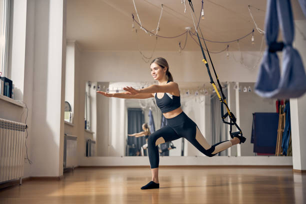 istock Woman standing on one leg during the strength workout 1253387423