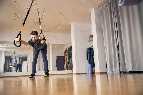 istock Male athlete performing a wide-stance hip hinge 1253387522