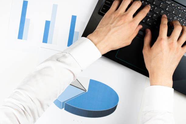 istock The hands of a busy man 1253389404