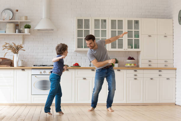 istock Overjoyed dad and little son have fun dancing 1253390196