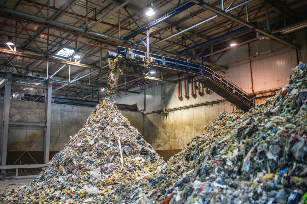 istock Piles of Separated Recyclables Inside Waste Facility 1253390368