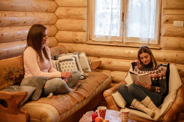istock Girlfriends relaxing together at home 1253390495