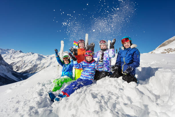 istock Ski class children group over mountain throw snow 1253390602