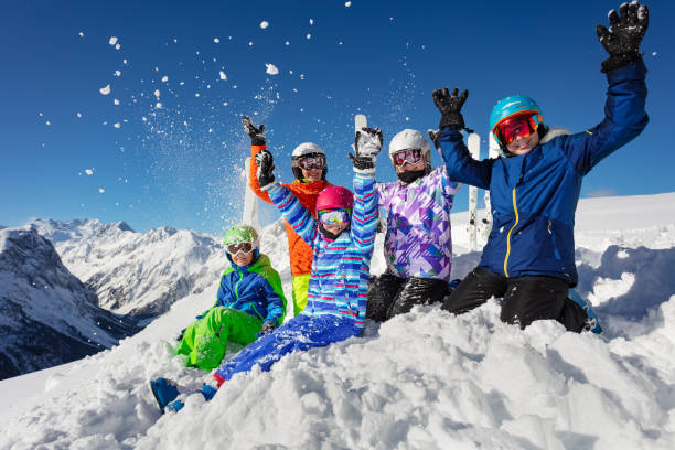 istock Ski class big kids group over mountain throw snow 1253390611