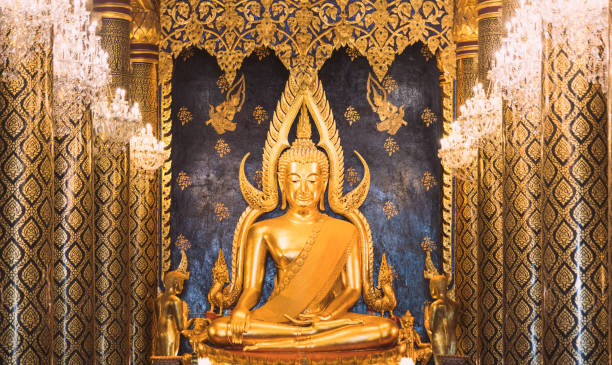 golden buddha statue in temple (wat ) decorated in beautiful lighting and interior most popular buddish temple in bangkok thailand - garuda bangkok thailand gold imagens e fotografias de stock