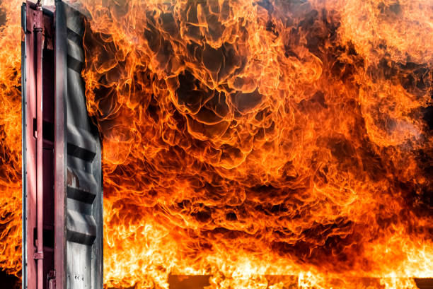 istock Fire flames engulfing from explosion and billowing inside burning premises. Blaze fire flames texture background. Firefighter on duty rescue and industrial safety concept. 1253392131