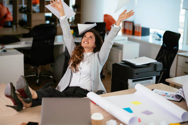 istock Businesswoman celebrating wining a new project 1253393029
