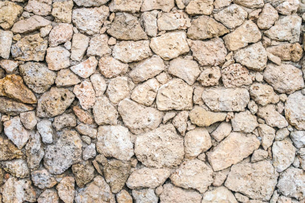 istock Old stone masonry. Background image of a historical wall. Stone wall from Sandstone. 1253397492