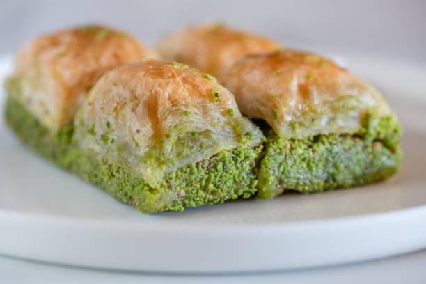 istock Traditional, delicious Turkish baklava on white plate 1253401504