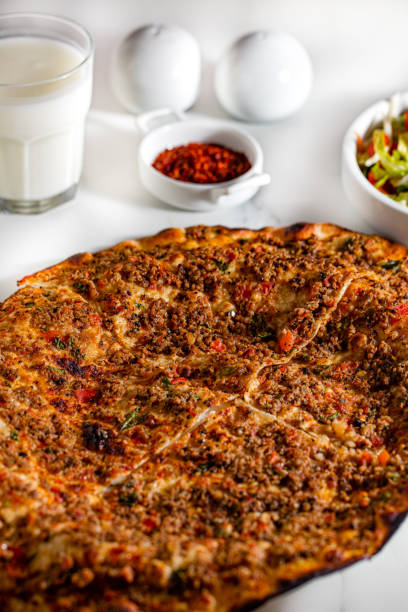 istock Turkish foods ,Turkish pizza, Lahmacun with red pepper 1253401572