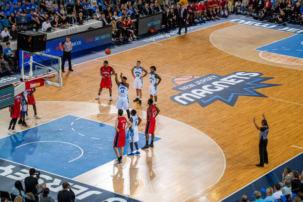 istock Basketball player taking penalty shot 1253403981