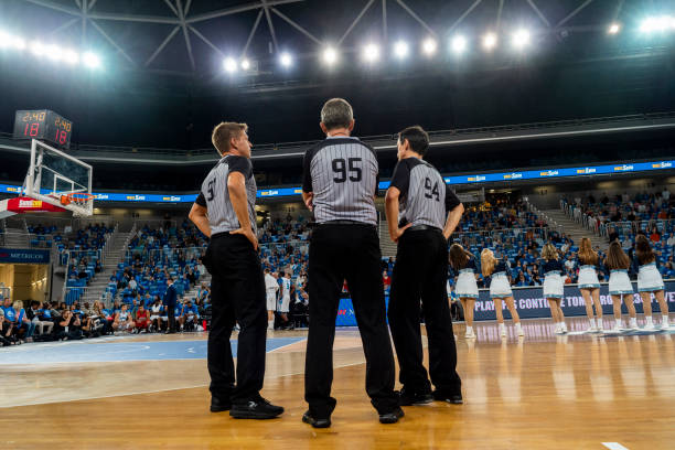 istock Referees standing on court 1253404052