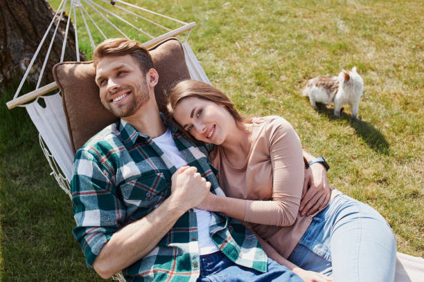istock Happy young man hugging her girlfriend outdoors 1253405250
