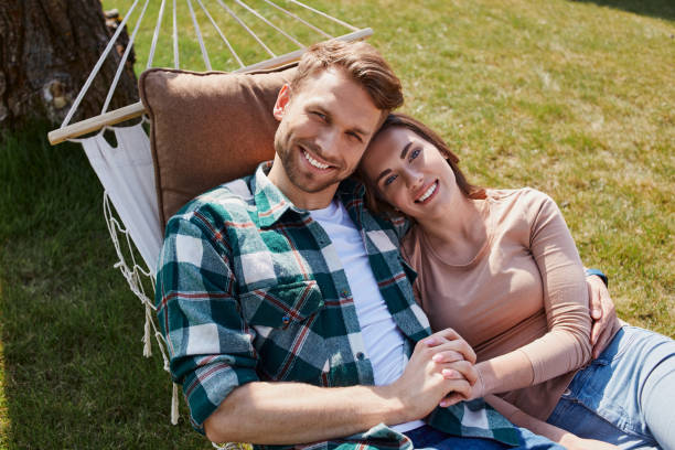 istock Smiling lovely couple posing on the camera 1253405254