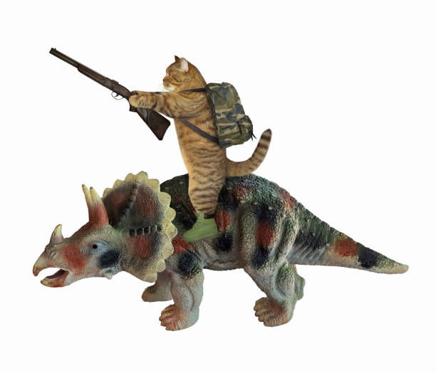 istock Cat with rifle riding triceratops 1253406443