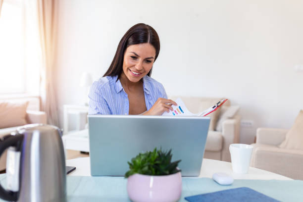 istock Young woman worker sit at home office reading paper document or contract feel confused with bad news, frustrated businesswoman stunned by received paperwork correspondence 1253407349