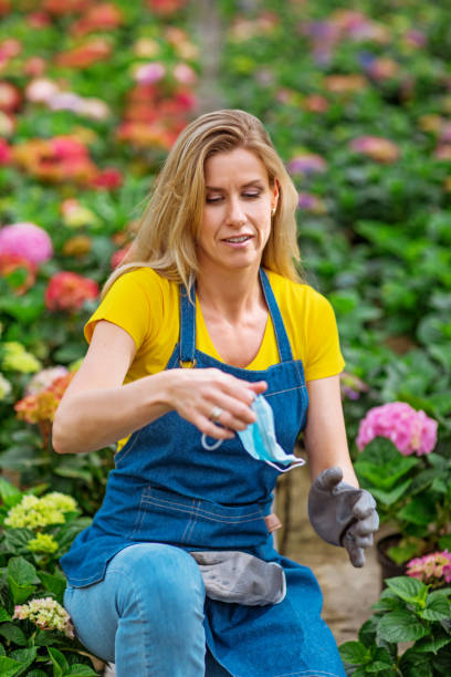 istock A female greenhouse worker 1253409232