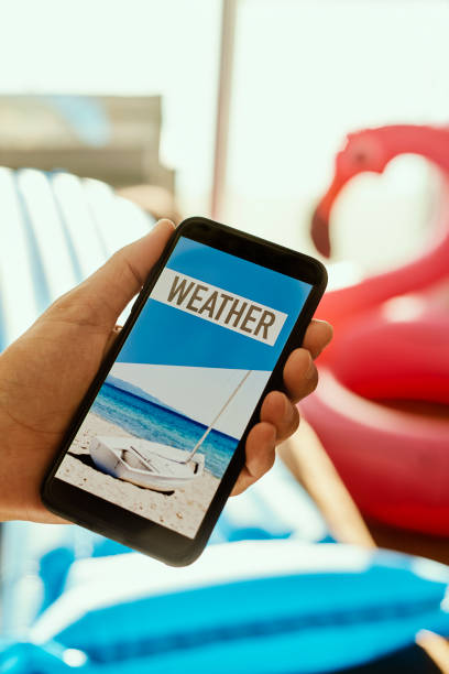 istock man and text weather in his smartphone 1253409976
